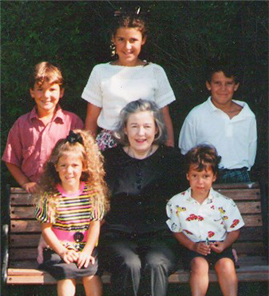 Margaret Ella Burke surrounded by her grandchildren 